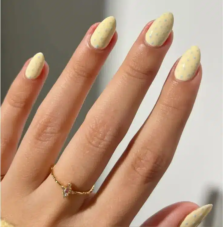 A view of yellow polka dots nail design A view of yellow polka dots nail design