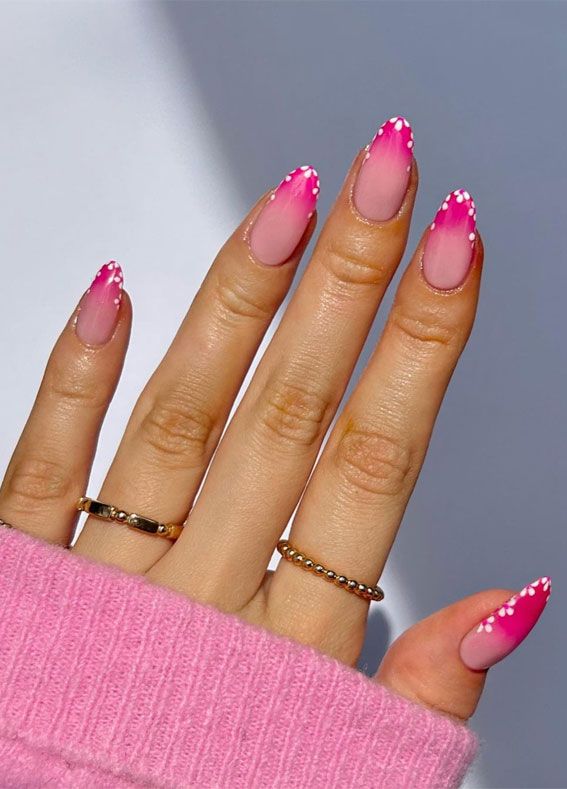 a female hand with ombre floral gradient nails