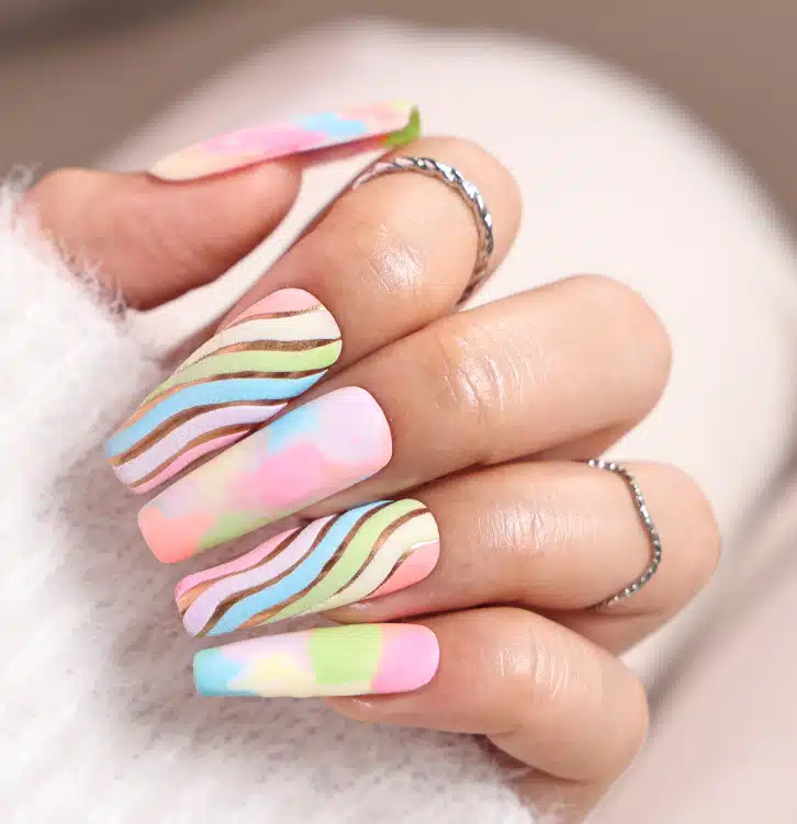 A view of colorful swirly pastel color polygel nails