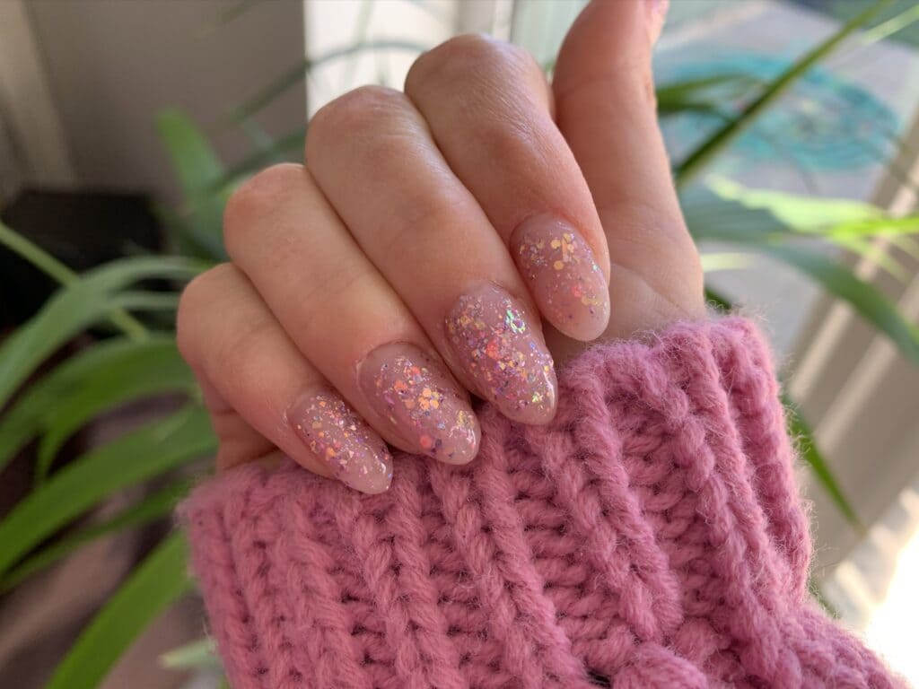 A view of pink glittery polygel nails x