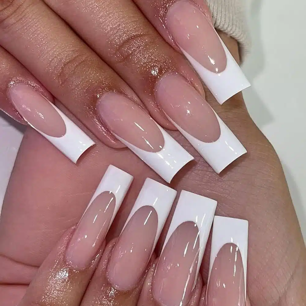 A view of square glossy nails tips with french manicure