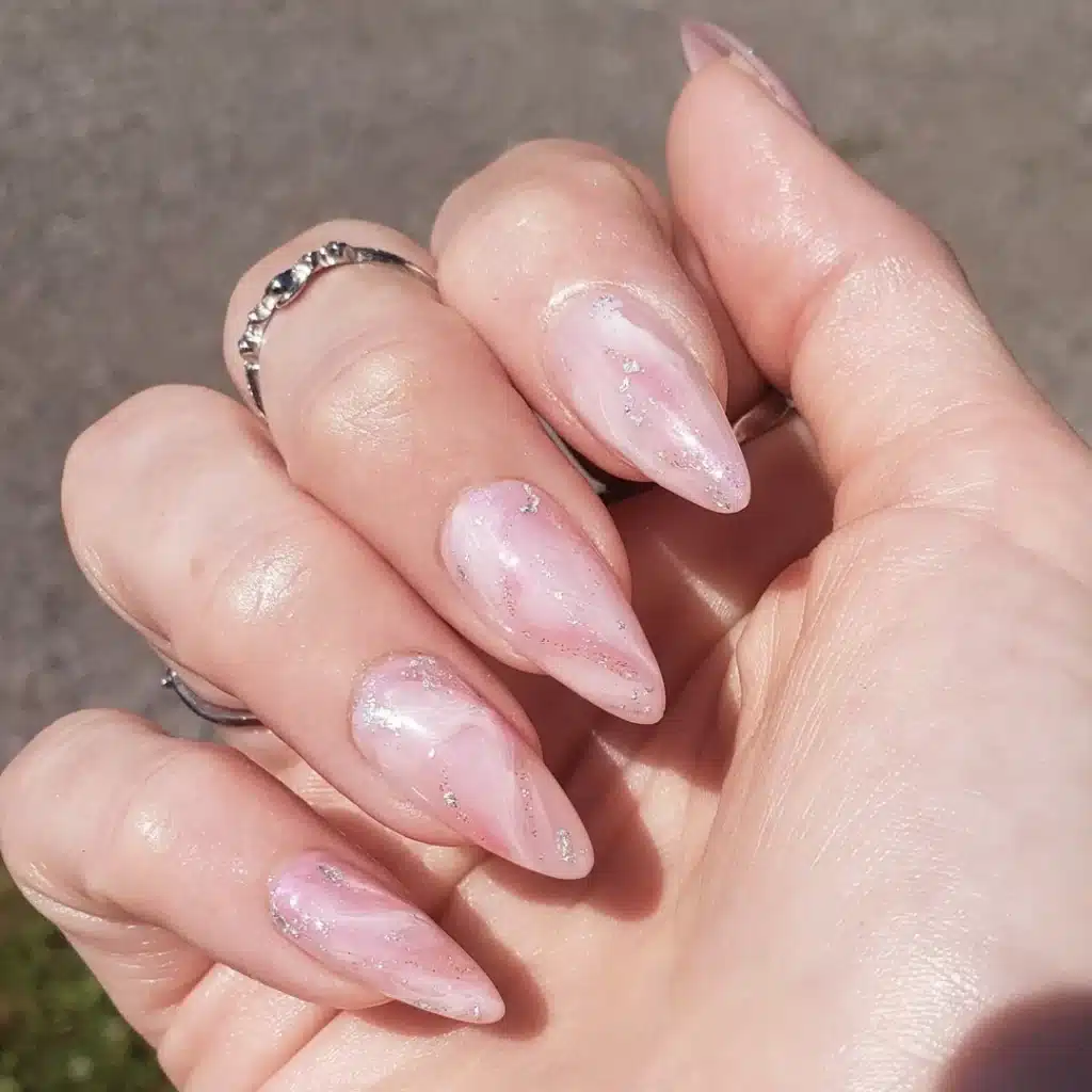 a girl hand with rose quartz nails x a girl hand with rose quartz nails x