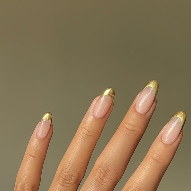 almond nails with french tips in golden chrome almond nails with french tips in golden chrome