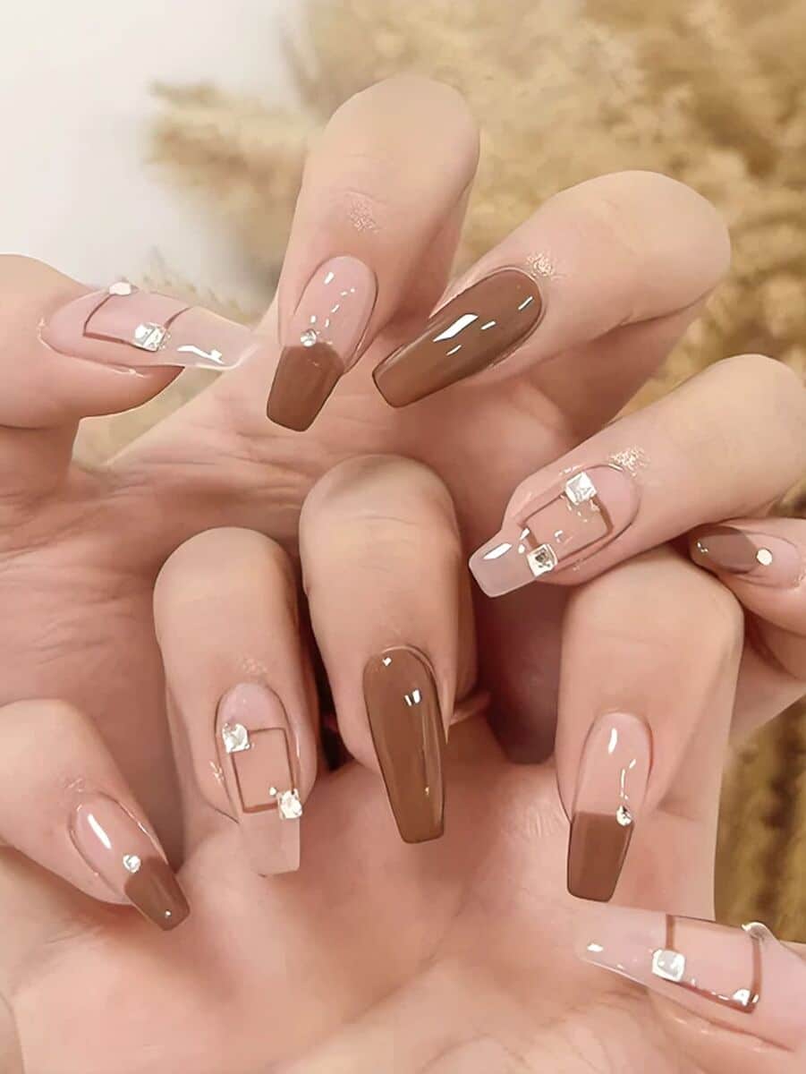 brown nails with geometric patterns and beads brown nails with geometric patterns and beads