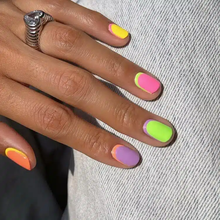 nail polish with neon green yellow pink and purple one ring in hand nail polish with neon green yellow pink and purple one ring in hand