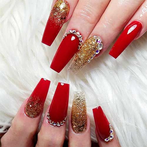 red and golden nail art with stones and glitter chunks red and golden nail art with stones and glitter chunks