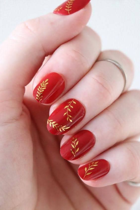 short nails with red and golden nail art short nails with red and golden nail art