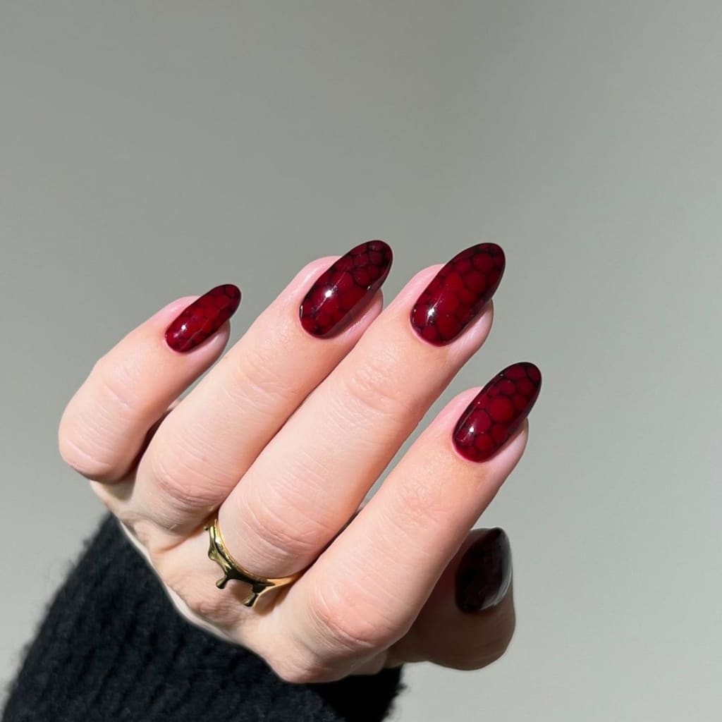 A view of burgundy halloween nails A view of burgundy halloween nails