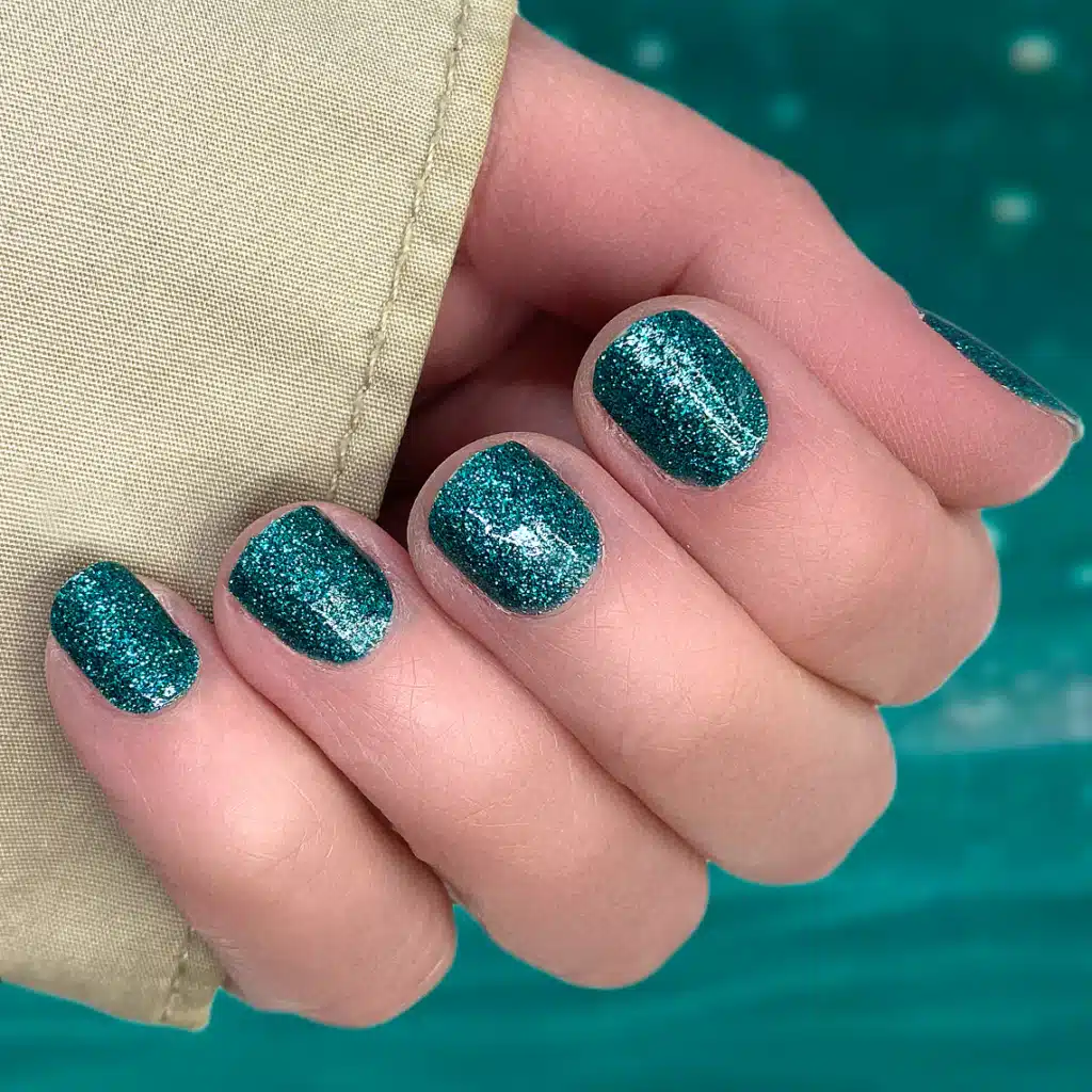 A view of teal glitter nails A view of teal glitter nails