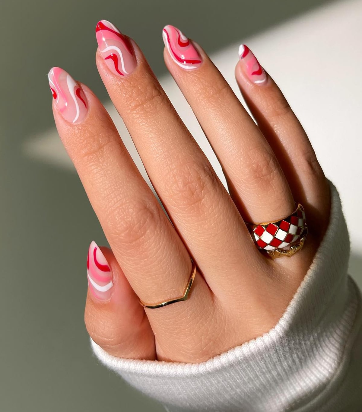 Abstract Swirls nail art with pink and red color