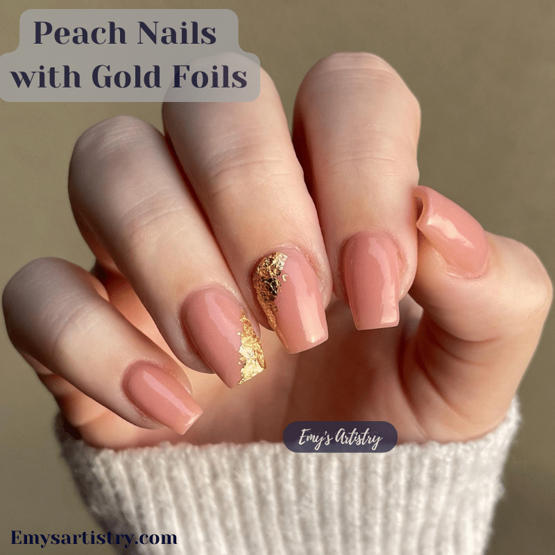 Peach nails with gold foil on two of them