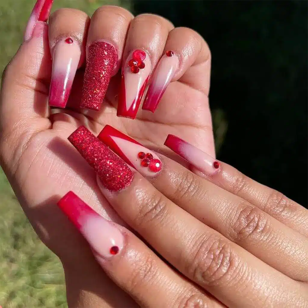 female hands with Matte Red with Pink Glitter nail art