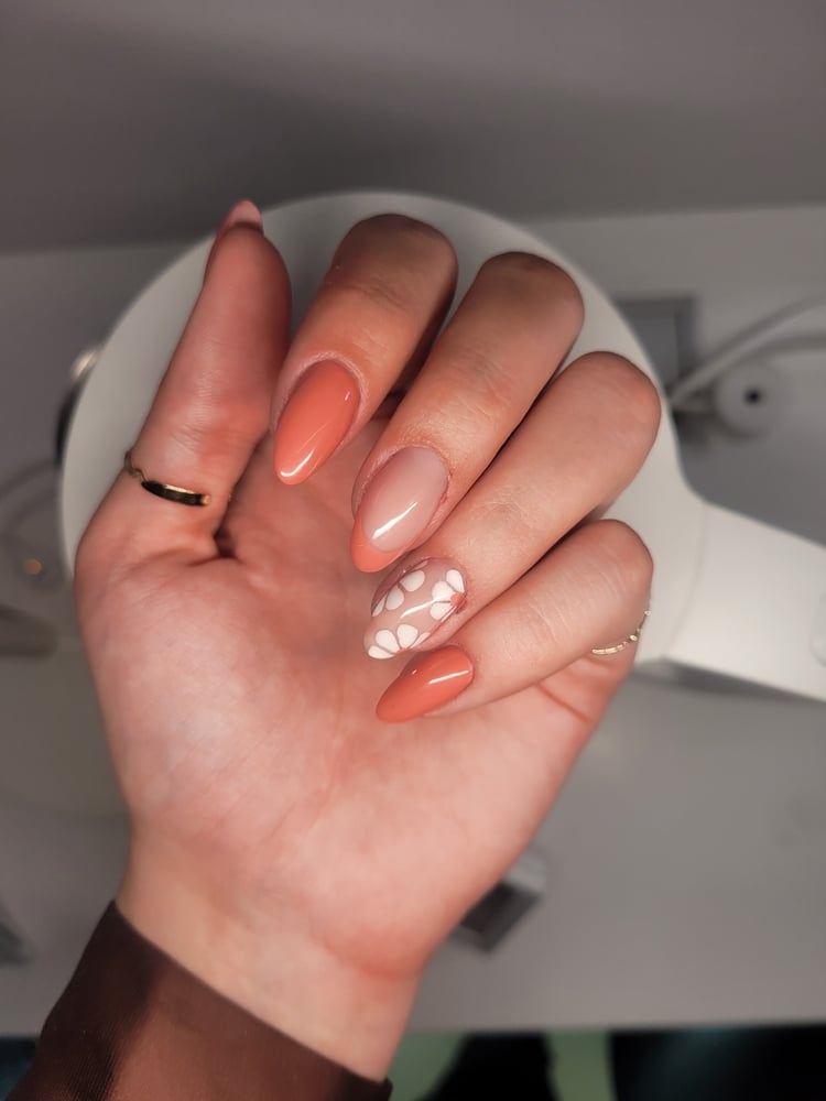 A view of nails with burnt orange nail color A view of nails with burnt orange nail color