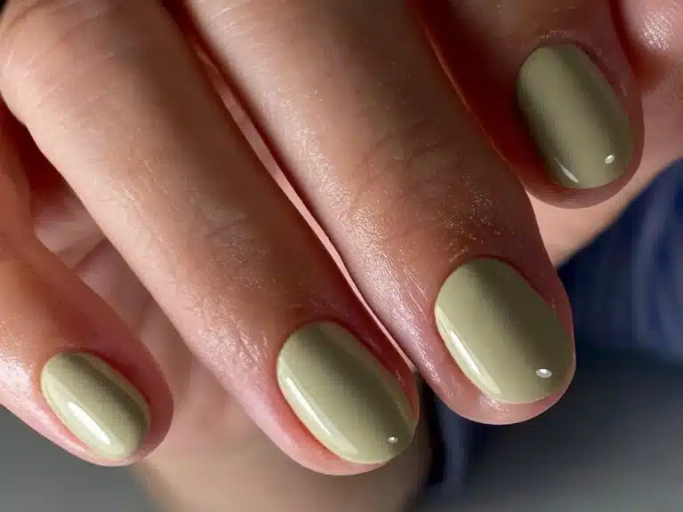 A view of pastel yellow colored summer nails