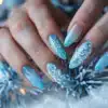 A view of icy blue nails on blue fur