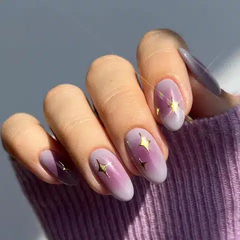Hands with purple aura nails