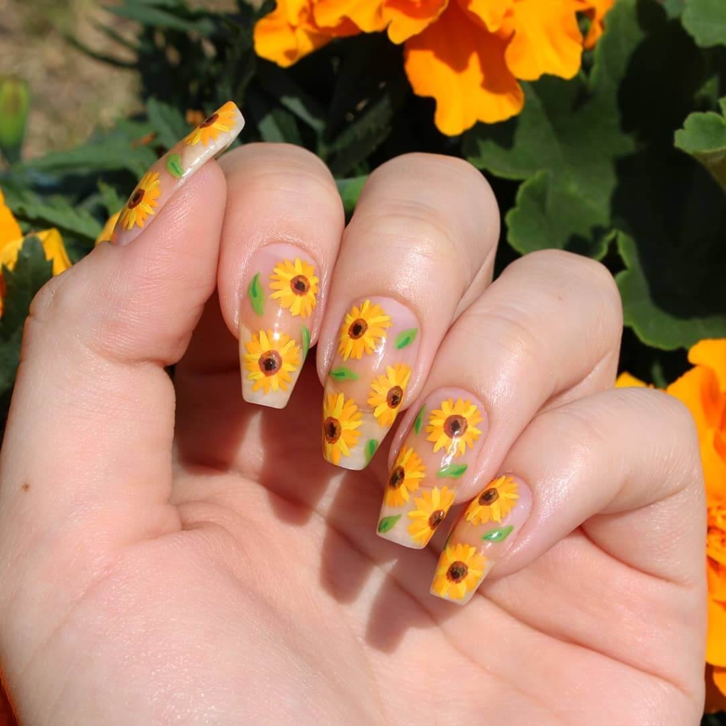 A view of sunflower design on nails A view of sunflower design on nails