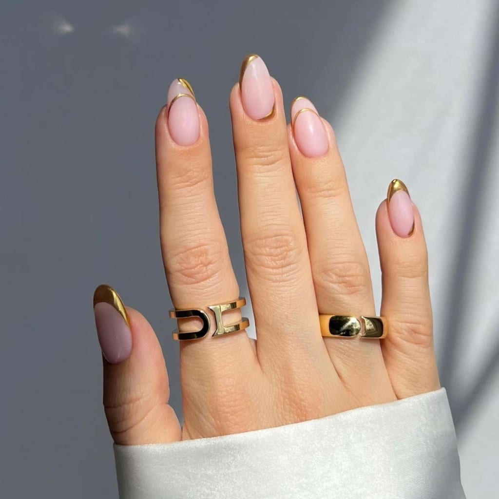 A view of gold chrome nails A view of gold chrome nails