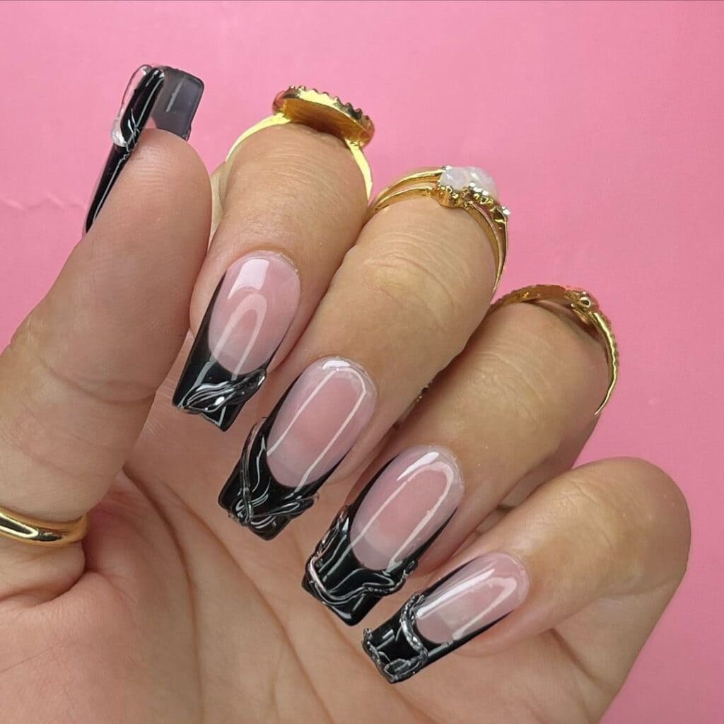 A hand with rings showing off D Sculpt Black French Tip Square Nails x A hand with rings showing off D Sculpt Black French Tip Square Nails x