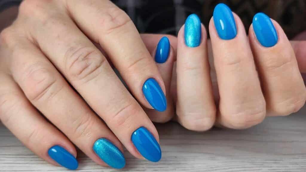 A view of blue nail colored hands x A view of blue nail colored hands x