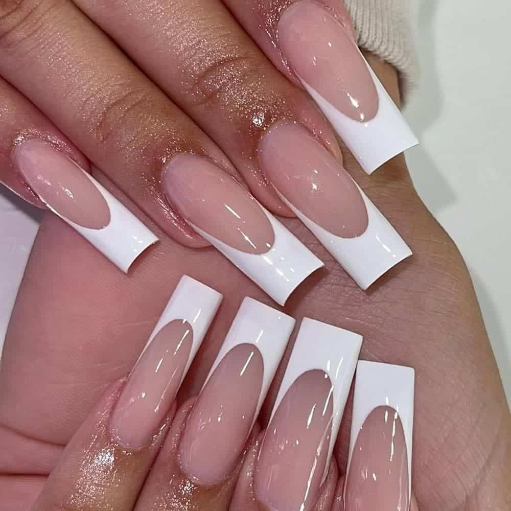 A view of square glossy nails tips with french manicure A view of square glossy nails tips with french manicure