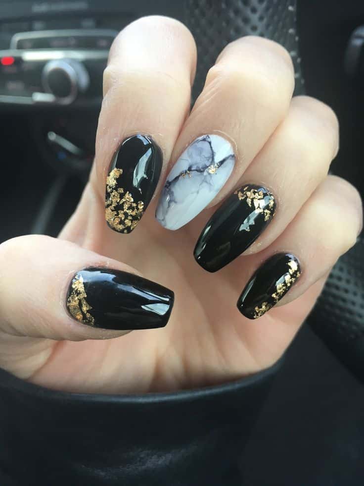 black and golden marble nail art on almond nails black and golden marble nail art on almond nails