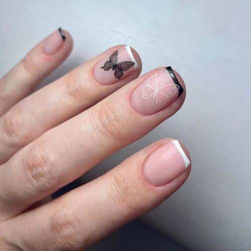 black butterfly silhouette on short pink nails with french tips black butterfly silhouette on short pink nails with french tips