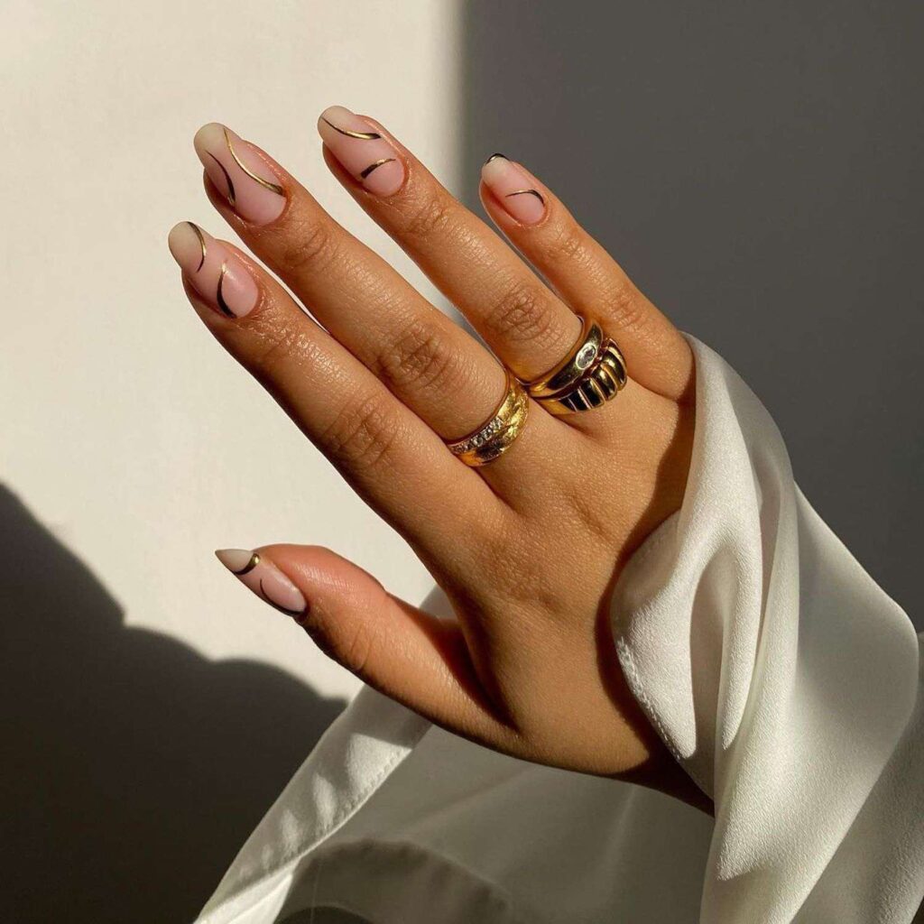 clear long nails wih golden swirls x clear long nails wih golden swirls x
