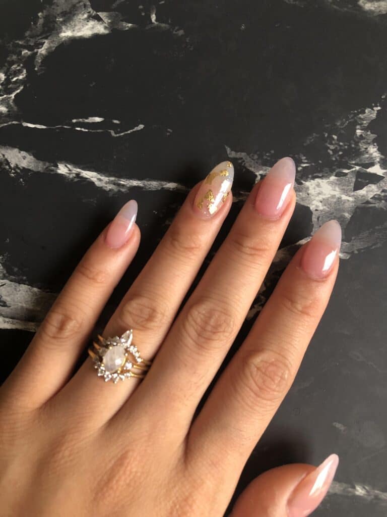 clear nails with a metallic gold accent nail girl wearing ring x clear nails with a metallic gold accent nail girl wearing ring x
