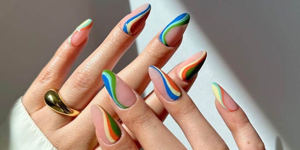 colorful swirl patterns on long nails girl wearing ring on one hand x colorful swirl patterns on long nails girl wearing ring on one hand x