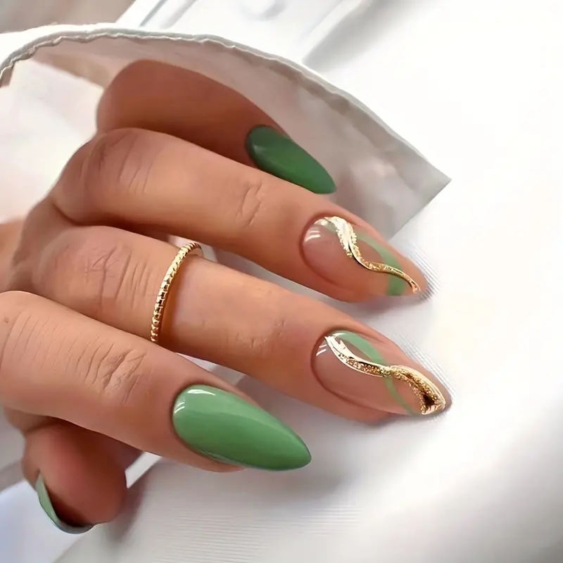 green nails with golden swirls green nails with golden swirls