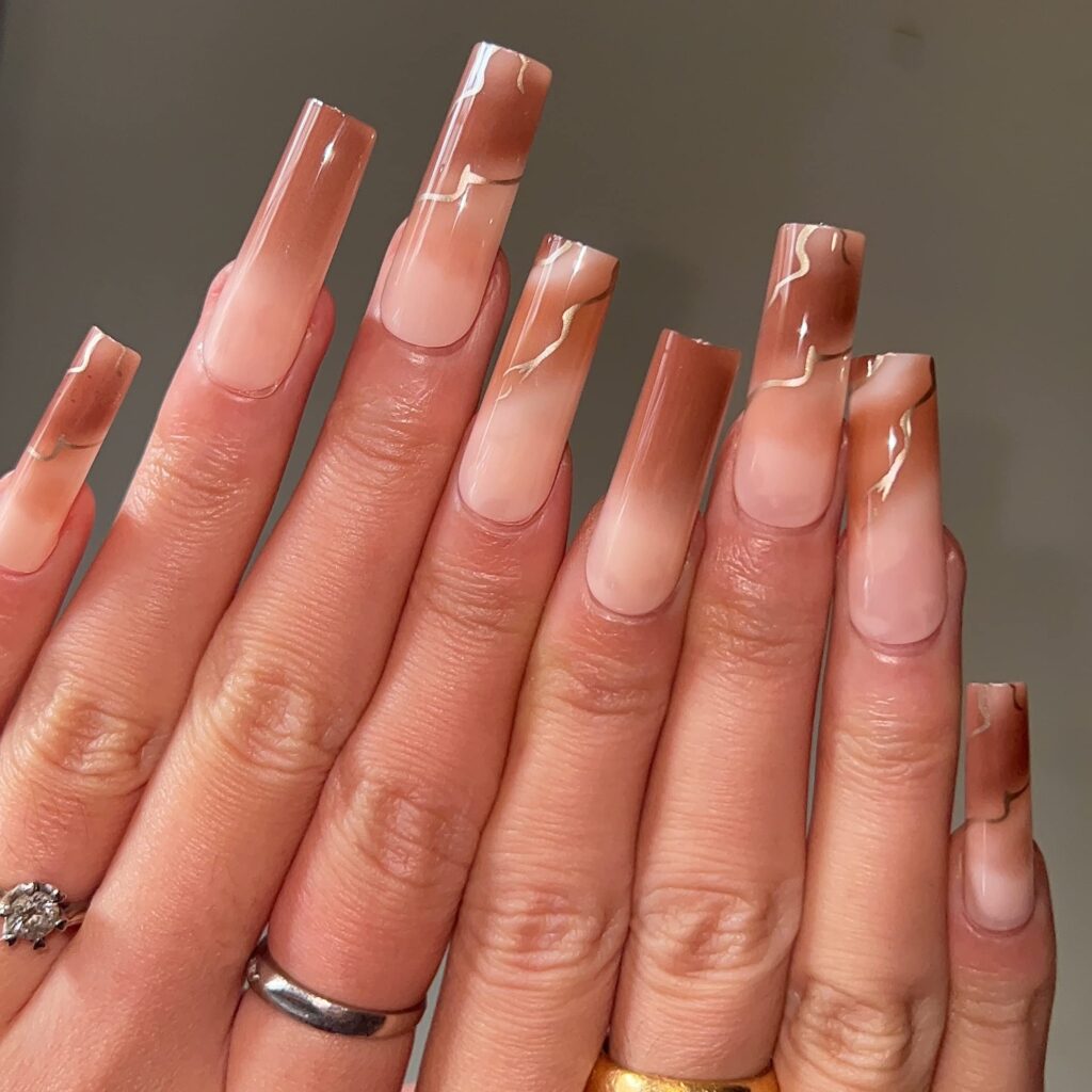 marble effect brown nails with peach and pink mixture