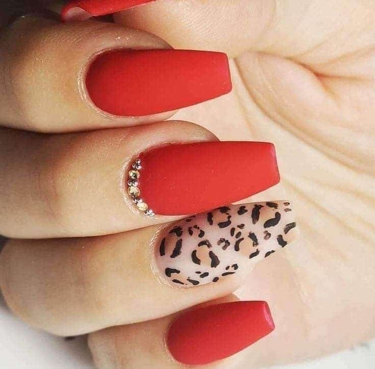 matte red nails with leopard print on one nail matte red nails with leopard print on one nail