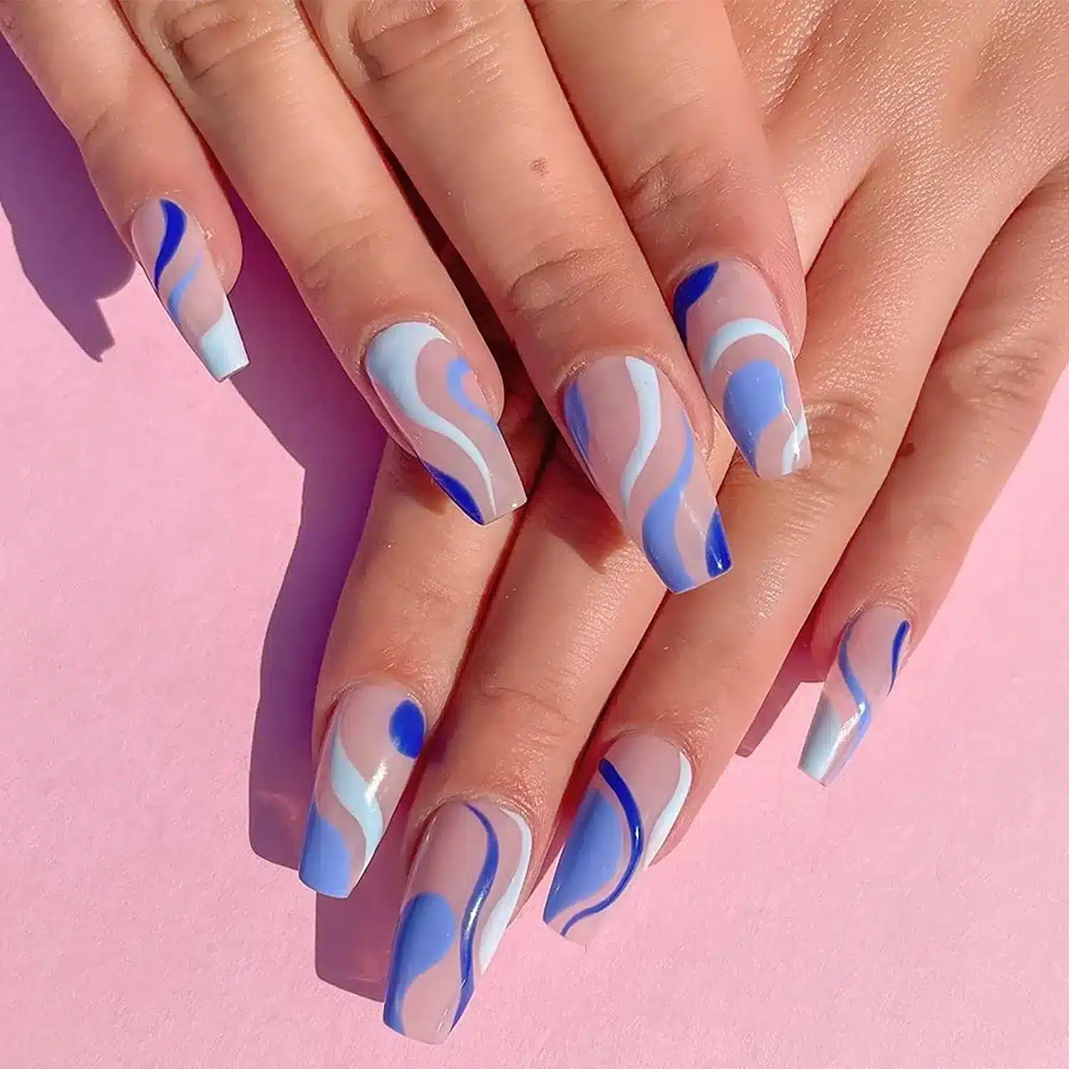 A view of long blue swirlies press on nails A view of long blue swirlies press on nails