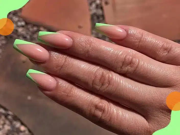 a female hand with neon green tips and negative space in nails jpg a female hand with neon green tips and negative space in nails jpg