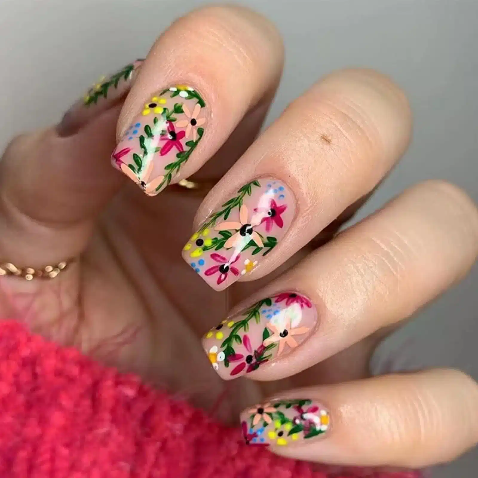 zoomed in view of a hand with floral nails jpg zoomed in view of a hand with floral nails jpg