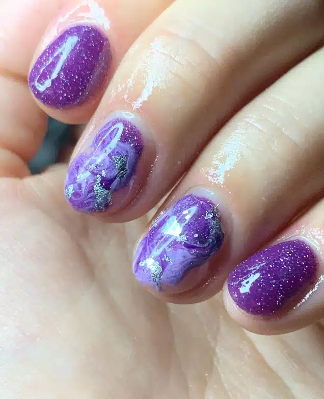 A view of purple marble nails A view of purple marble nails