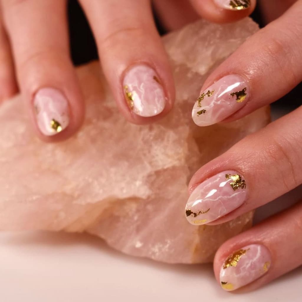 A view of peach and gold foil nails A view of peach and gold foil nails