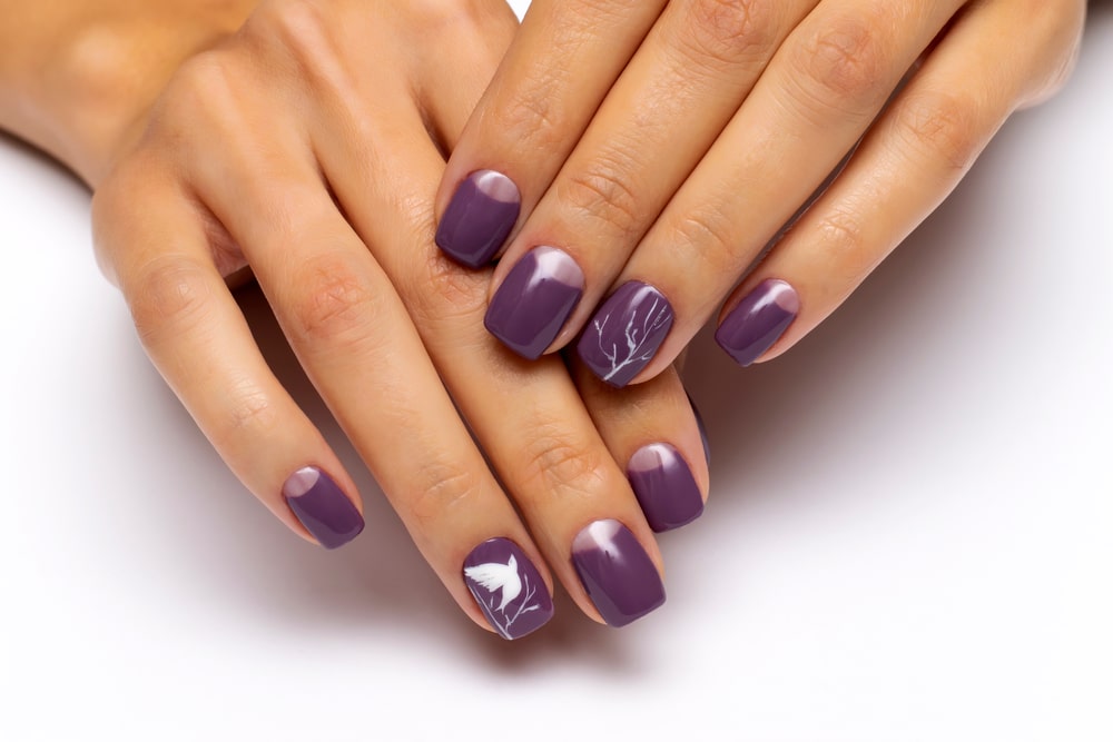 Purple Moon Manicure With Painted White Doves on nails