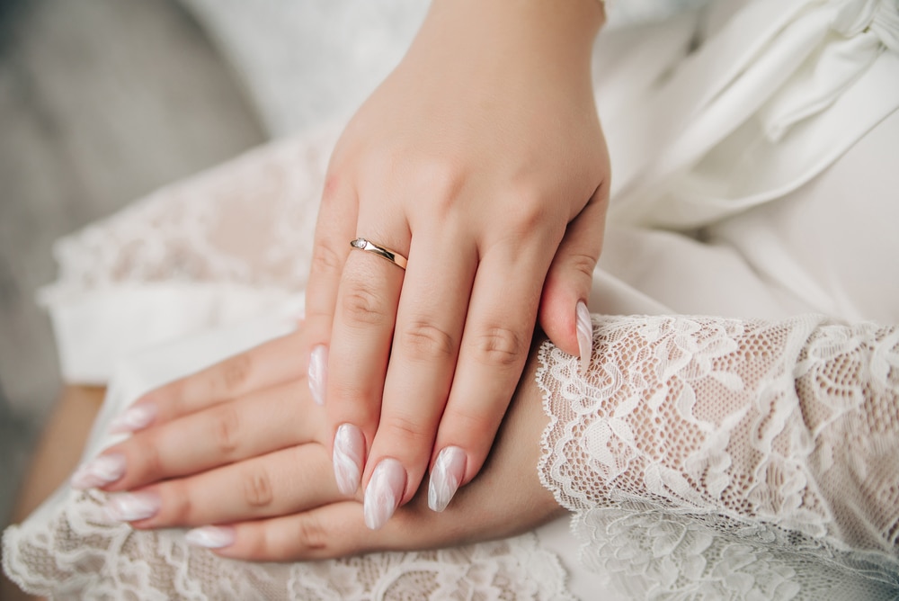 A view of a girl showing off her wedding nails A view of a girl showing off her wedding nails