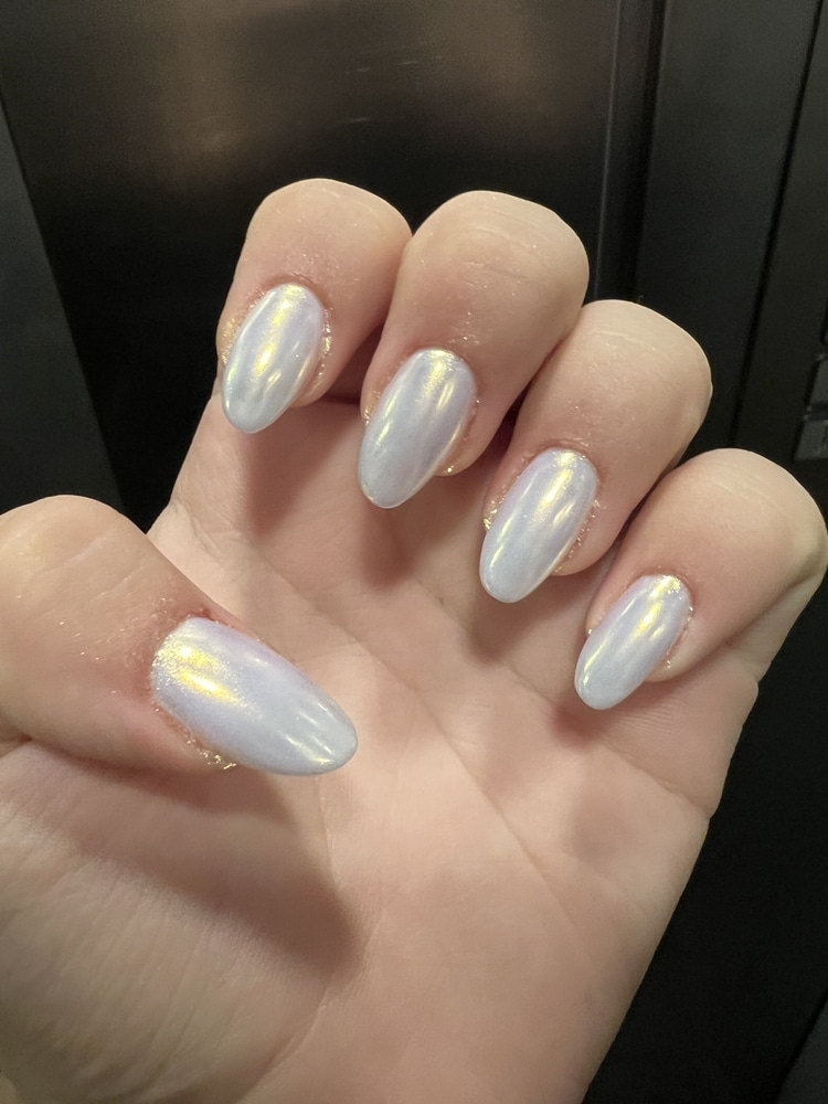 A view of a girl's hands with pearly nails A view of a girl's hands with pearly nails