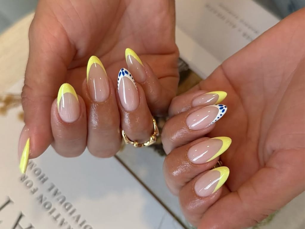 A view of yellow french nail tips A view of yellow french nail tips