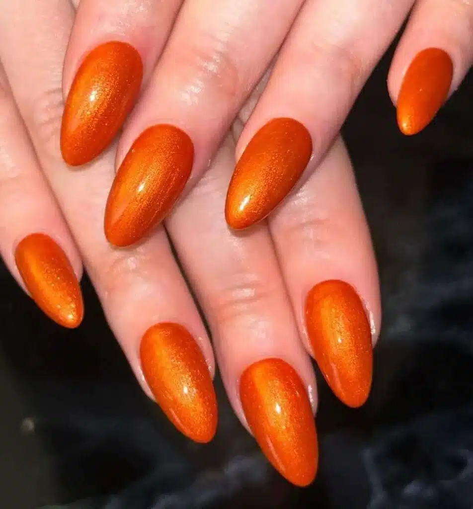 A top view of nails with burnt orange color A top view of nails with burnt orange color